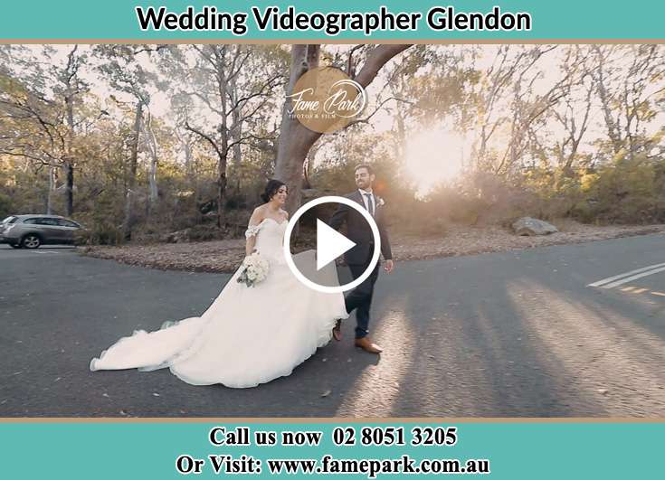 The Groom and the Bride walking in the car park Glendon NSW 2330