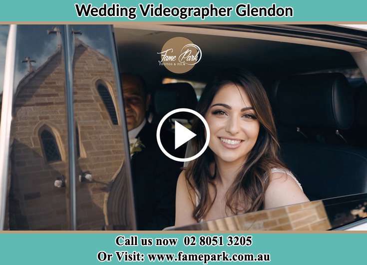 The Bride smiles for the camera inside the wedding car Glendon NSW 2330